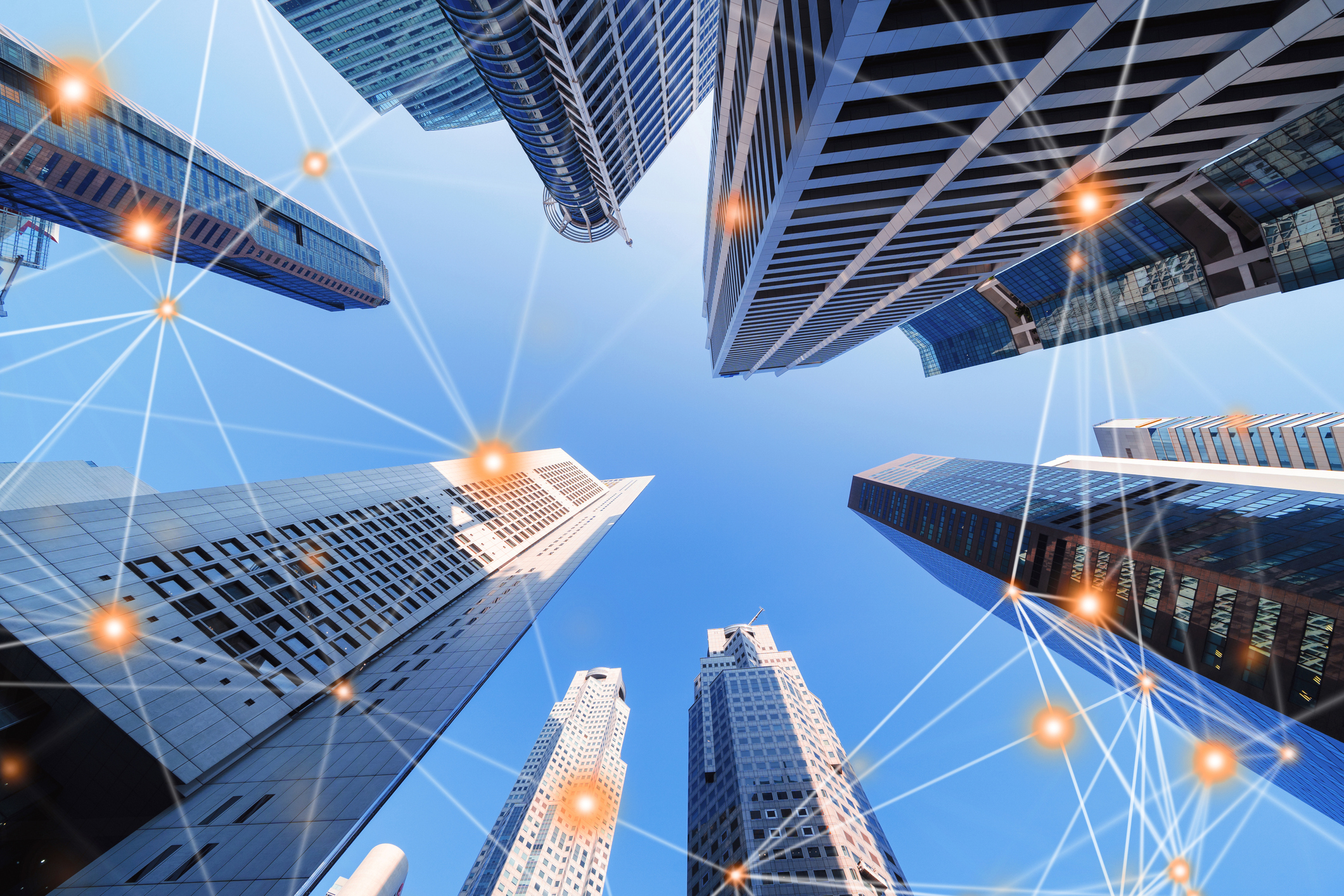 Digital network connection lines of architectures, skyscraper buildings in Singapore City with blue sky.